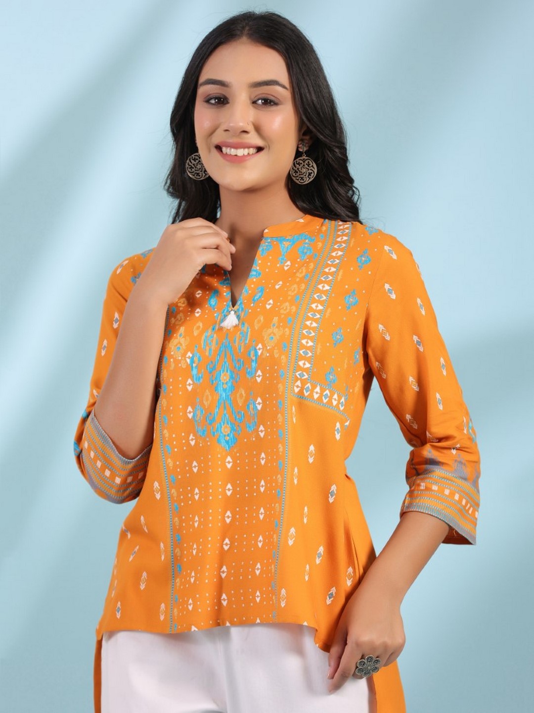 Mustard Rayon Ikat Placement Printed High-Low Tunic With Side Slits & Tassels