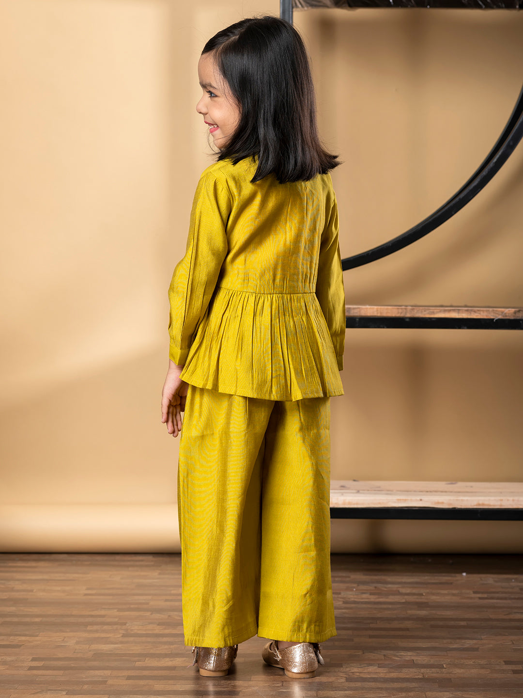 Girls Peplum Style Roman Silk Fabric Gold Color Kurti With Palazzo