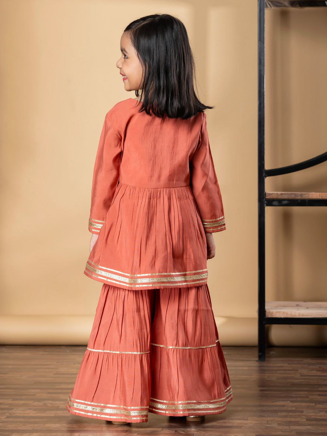 Girls Peplum Style Roman Silk Fabric Peach Color Kurti With Sharara