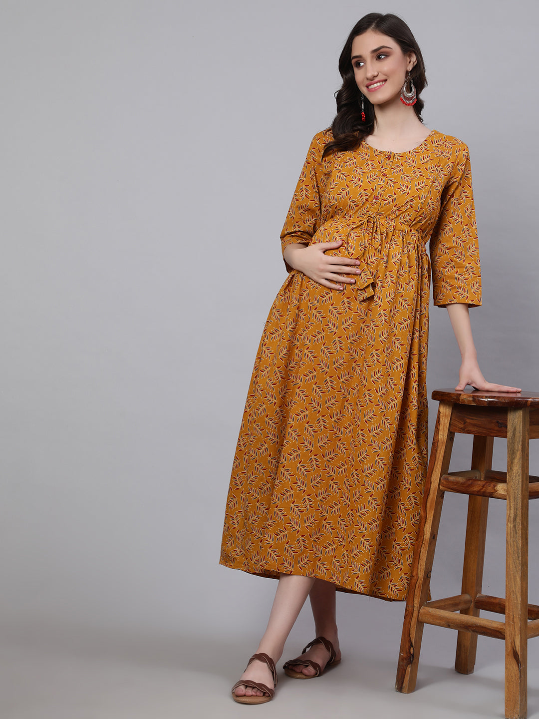 Women Mustard Printed Flared Maternity Dress Trendphoria Women Mustard Printed Flared Maternity Dress Trendphoria