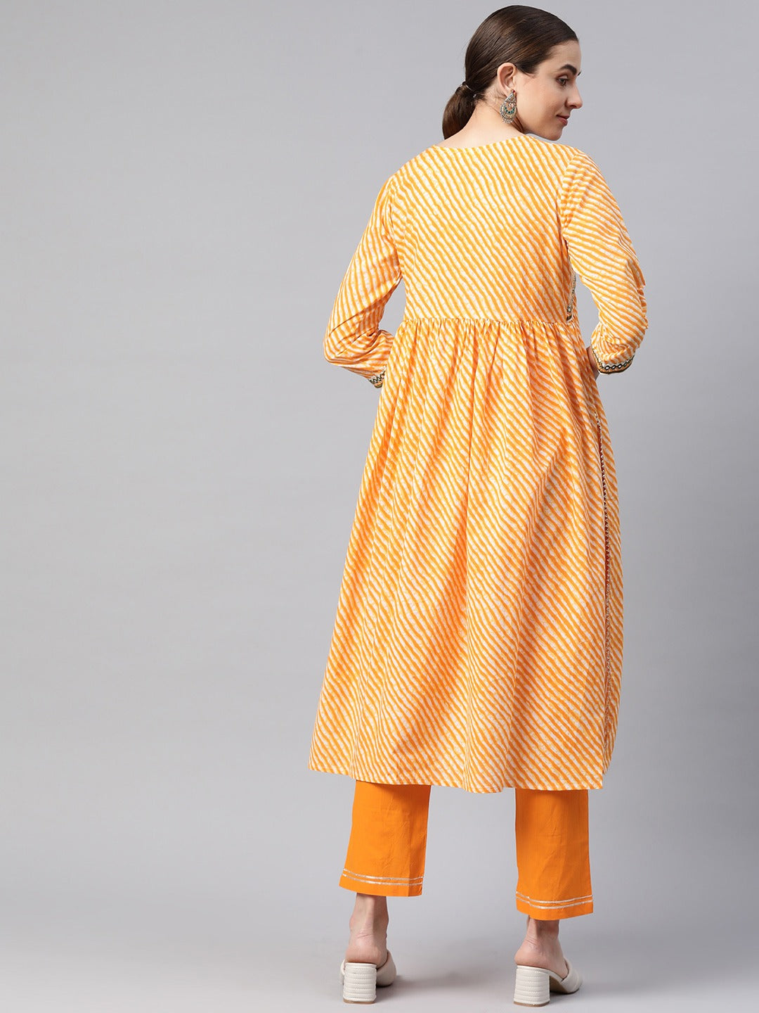 Flared Style Cotton Fabric Yellow Color Kurta With Bottom