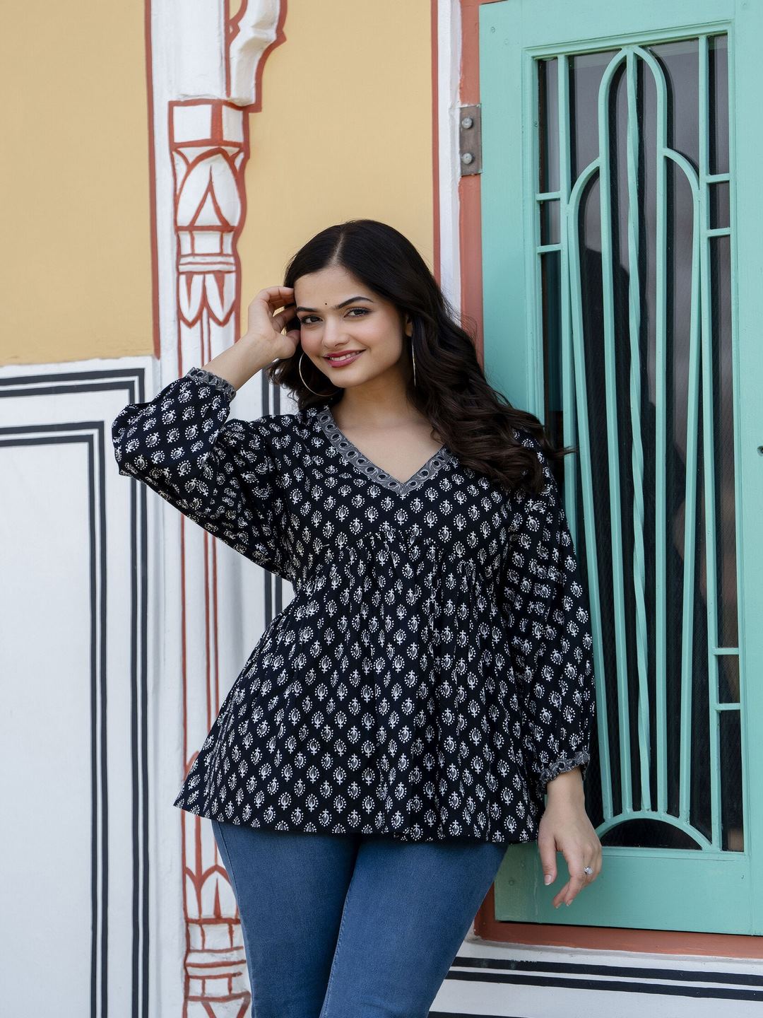 Black Printed V-Neck Peplum Top