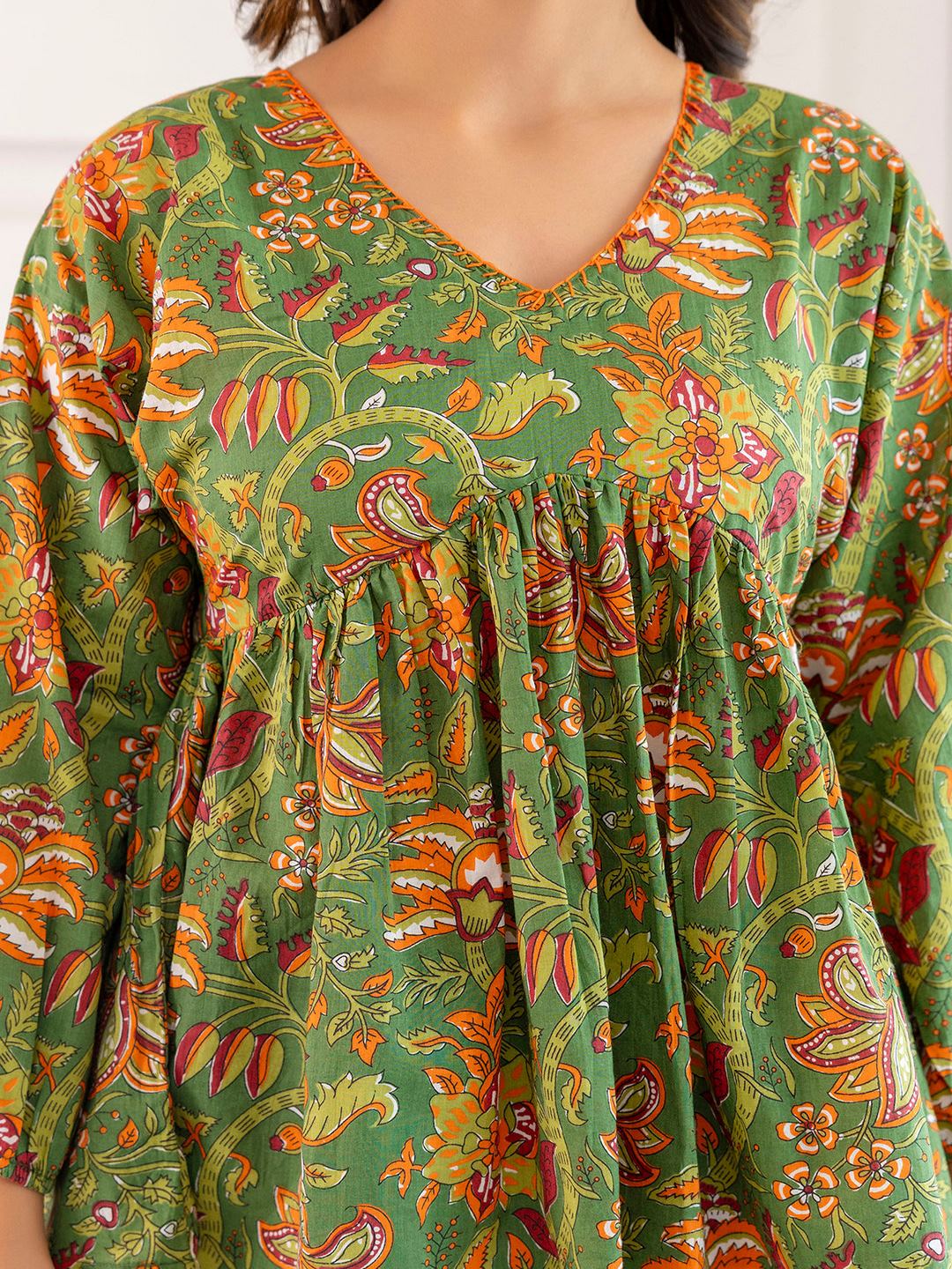 Green Printed V-Neck Peplum Tunic