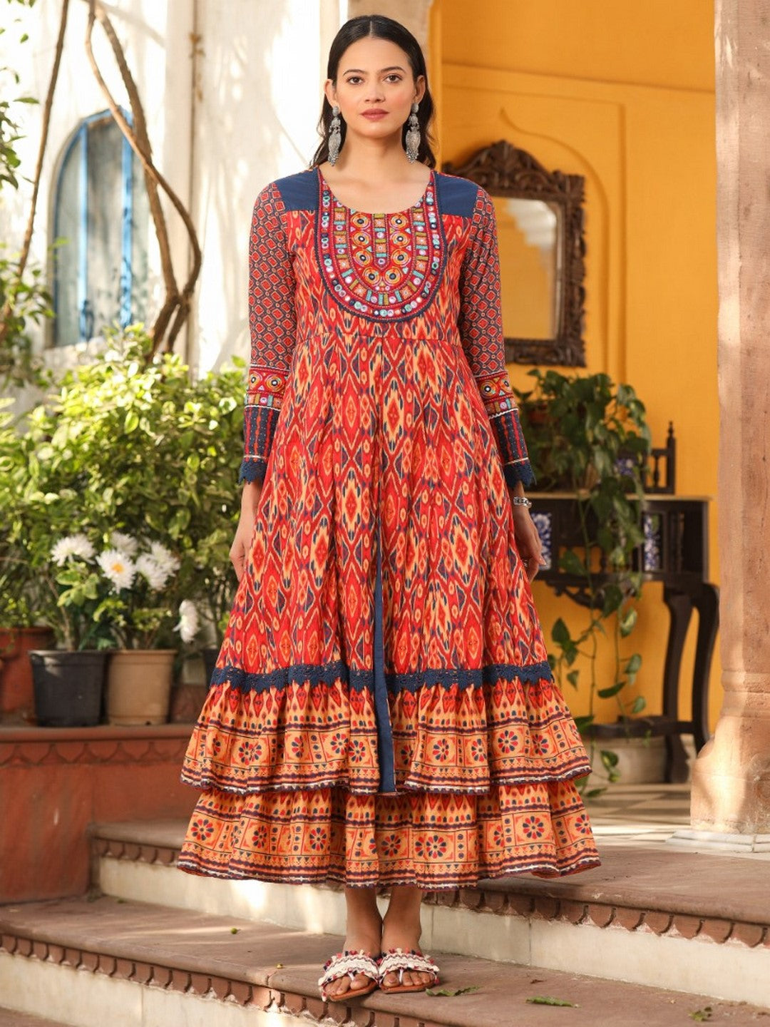 Rust Cotton Ikat Printed Layered Maxi Dress With Thread Embroidery & Dori Tassel Tie-Up At Waist