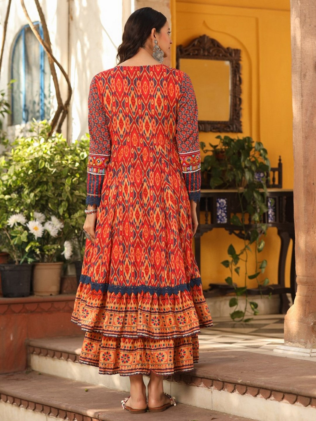 Rust Cotton Ikat Printed Layered Maxi Dress With Thread Embroidery & Dori Tassel Tie-Up At Waist