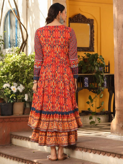Rust Cotton Ikat Printed Layered Maxi Dress With Thread Embroidery & Dori Tassel Tie-Up At Waist