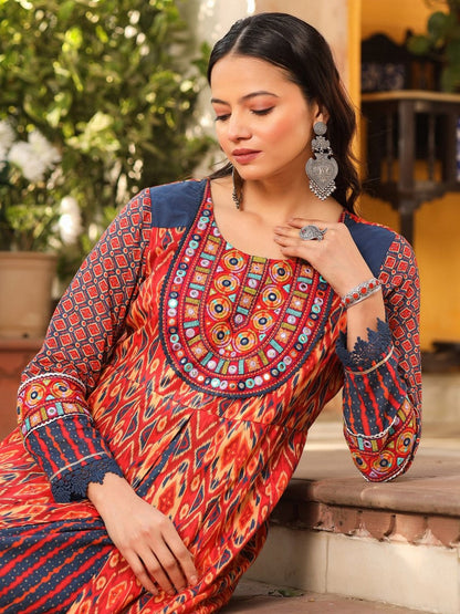 Rust Cotton Ikat Printed Layered Maxi Dress With Thread Embroidery & Dori Tassel Tie-Up At Waist