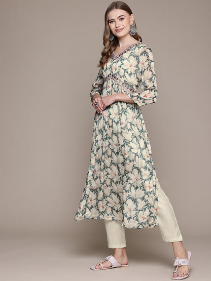 Flared Style Silk Fabric Cream Color Kurta With Bottom And Dupatta