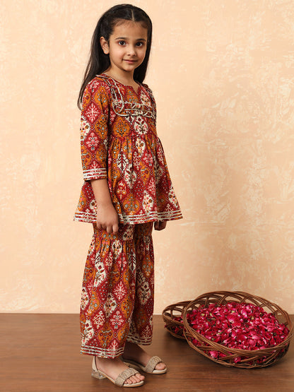 Girls Frock Style Cotton Fabric Maroon Color Floral Printed Kurti And Sharara With Gotta Lace Work