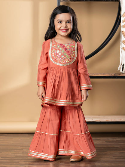 Girls Peplum Style Roman Silk Fabric Peach Color Kurti With Sharara