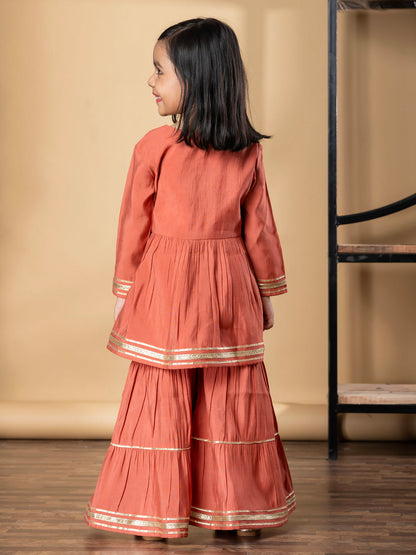 Girls Peplum Style Roman Silk Fabric Peach Color Kurti With Sharara