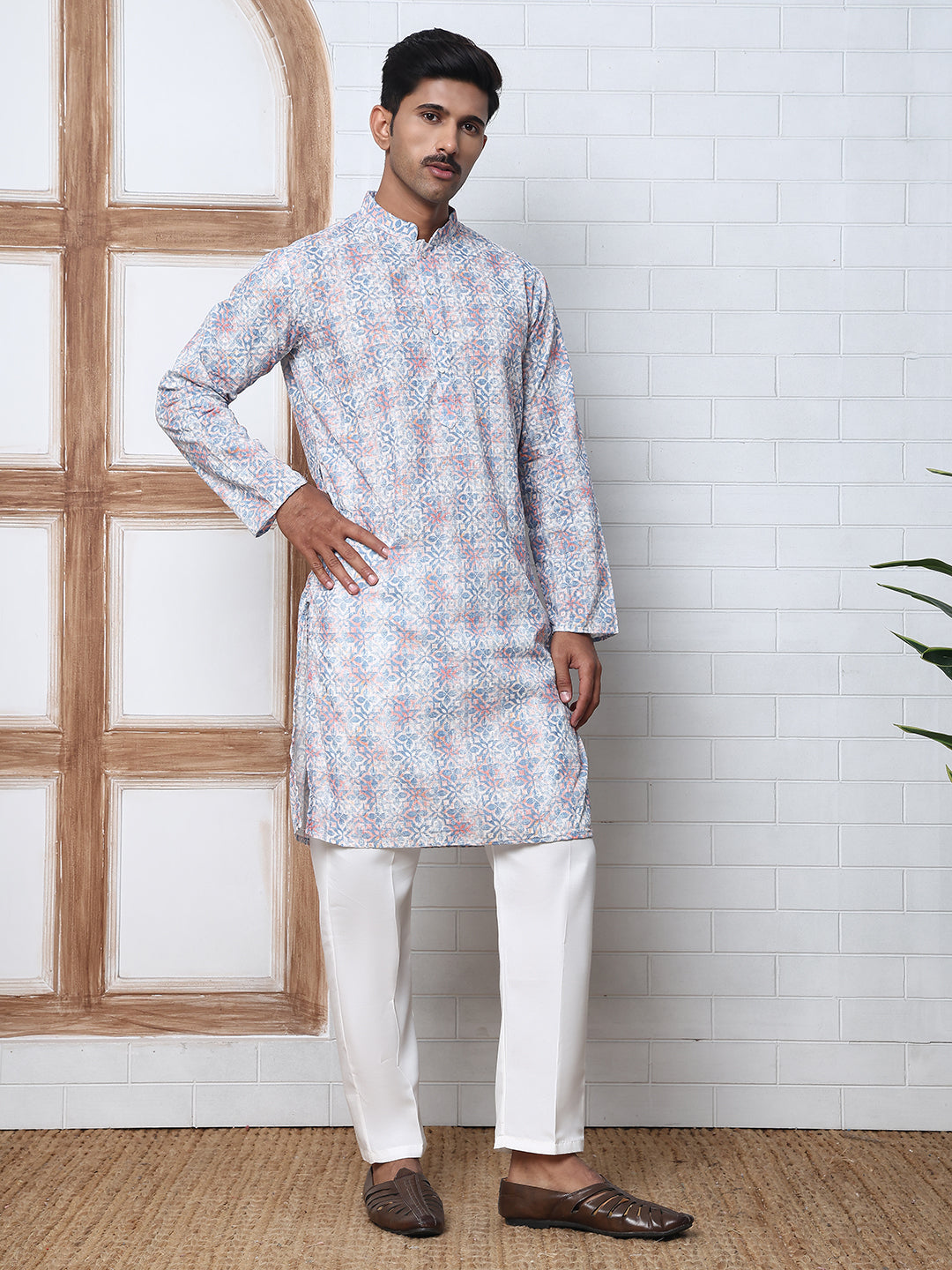 Printed And Embroidered Kurta Pyjama Set.
