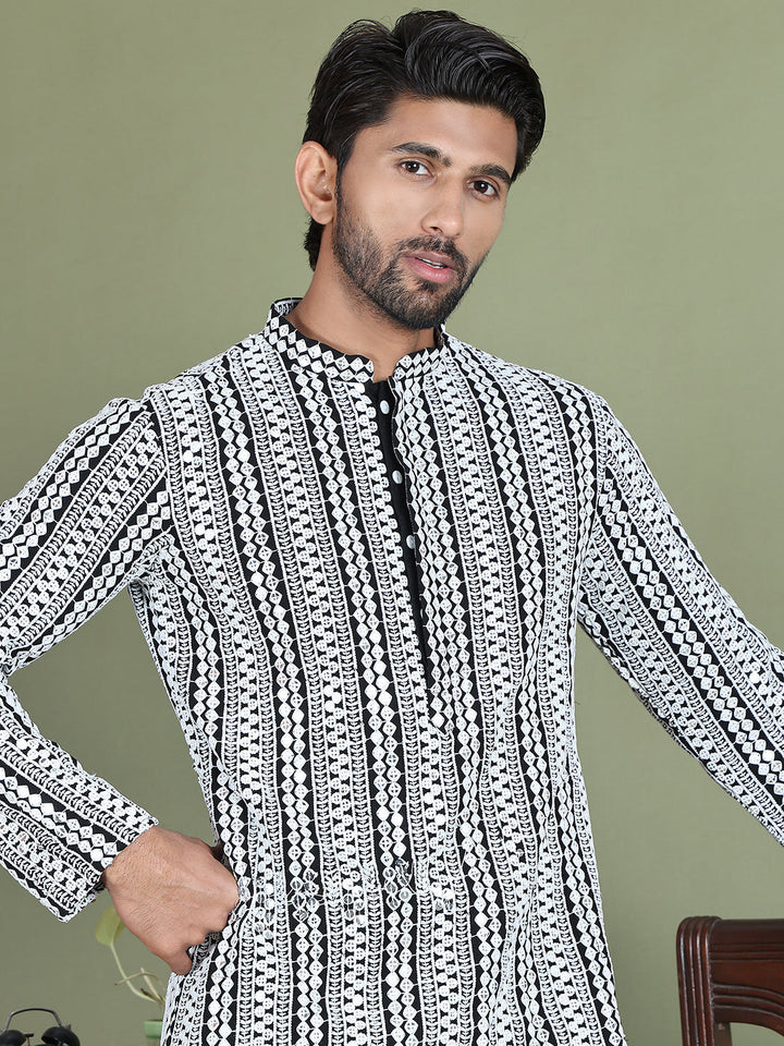 Embroidered And Mirror Work Kurta Pyjama Sets.