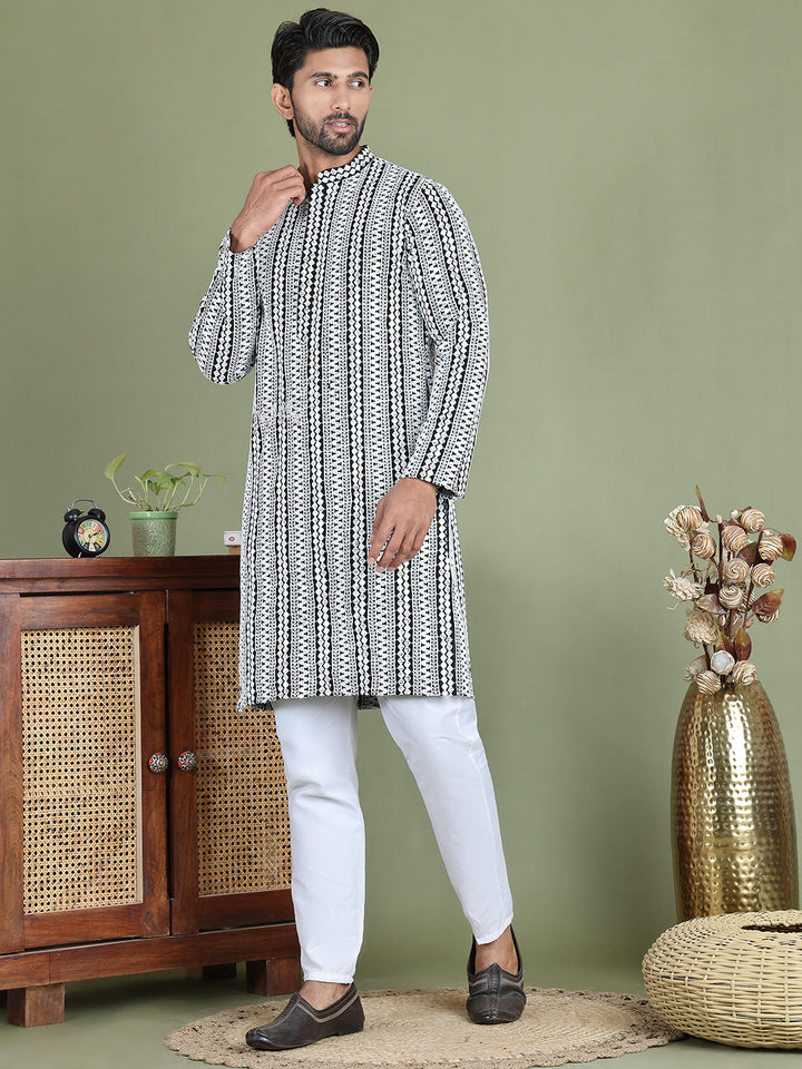 Embroidered And Mirror Work Kurta Pyjama Sets.