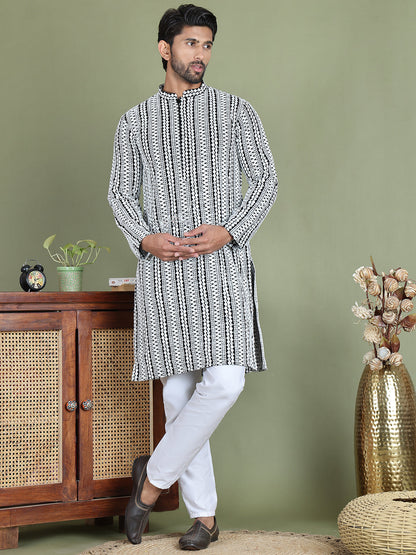 Embroidered And Mirror Work Kurta Pyjama Sets.