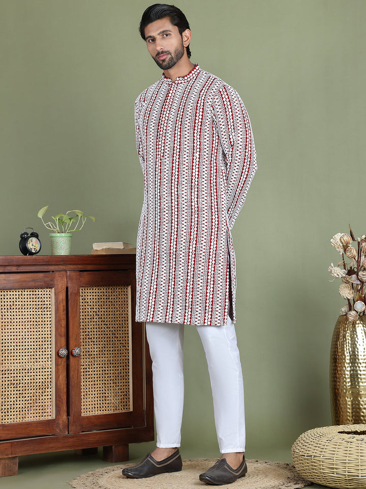Embroidered And Mirror Work Kurta Pyjama Sets.
