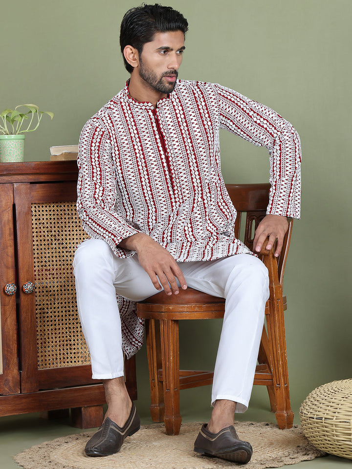 Embroidered And Mirror Work Kurta Pyjama Sets.