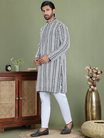 Embroidered And Mirror Work Kurta Pyjama Sets.