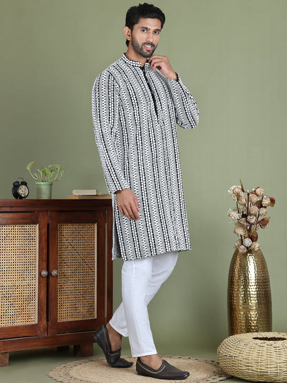 Embroidered And Mirror Work Kurta Pyjama Sets.