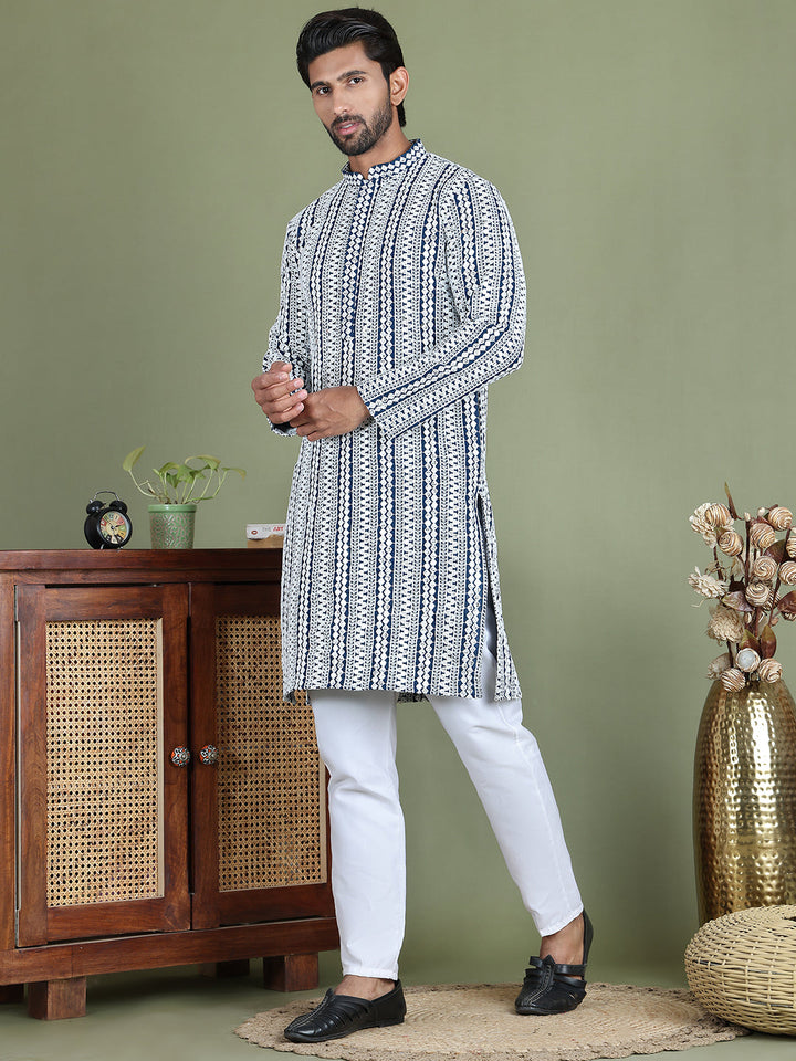 Embroidered And Mirror Work Kurta Pyjama Sets.