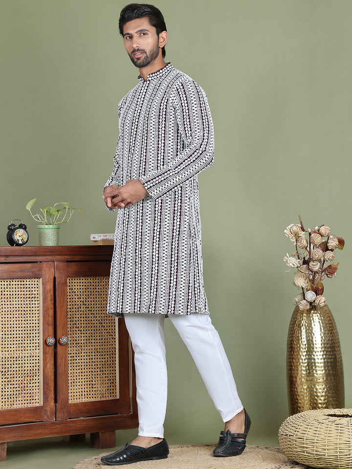 Embroidered And Mirror Work Kurta Pyjama Sets.