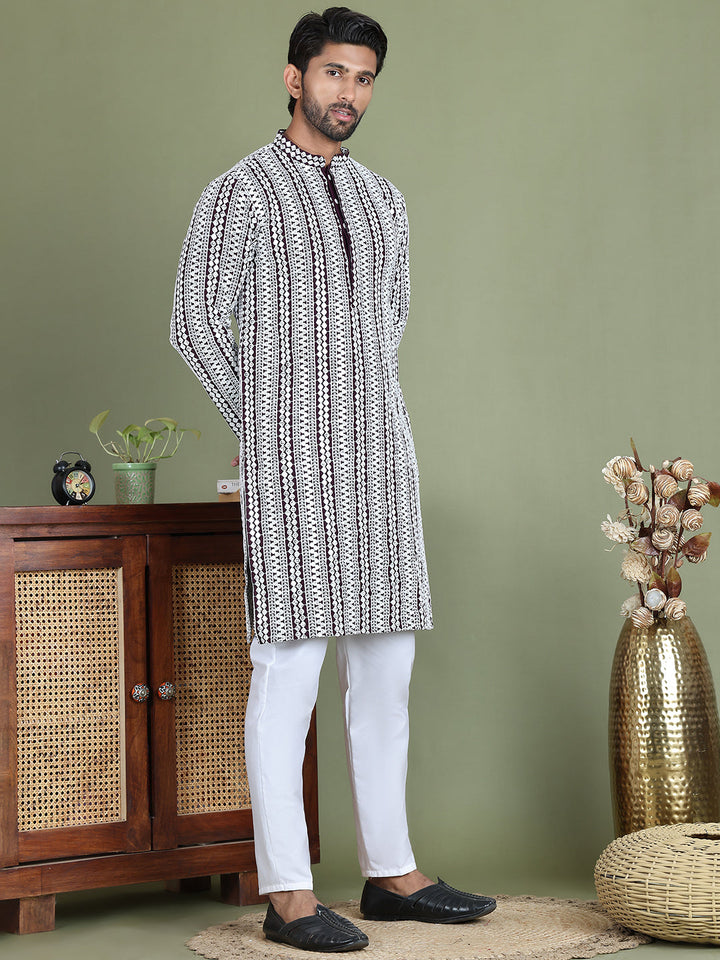 Embroidered And Mirror Work Kurta Pyjama Sets.