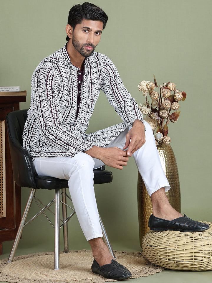 Embroidered And Mirror Work Kurta Pyjama Sets.