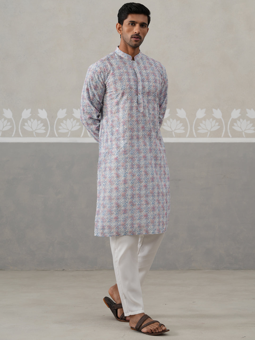Printed And Embroidered Kurta Pyjama Set.