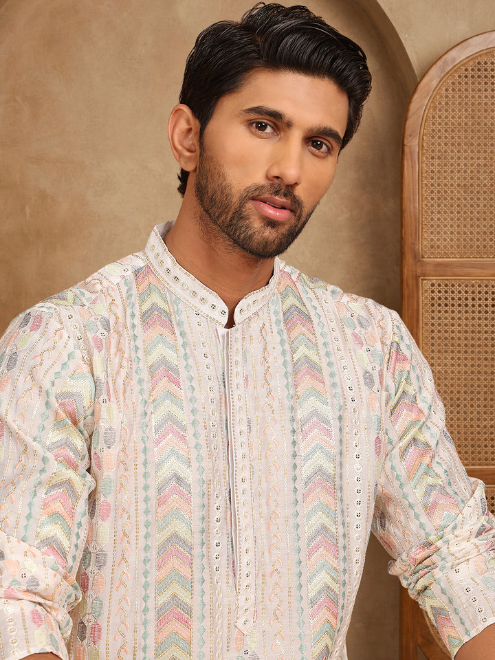 White Embroidered And Sequins Kurta, White Straight Knee Length Kurta, Has A Mandarin Collar, Long Sleeves, Straight Hem.
