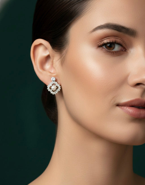 Two pairs of stud earrings