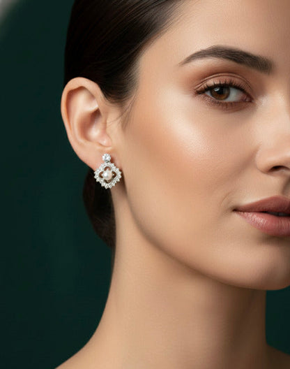 Two pairs of stud earrings