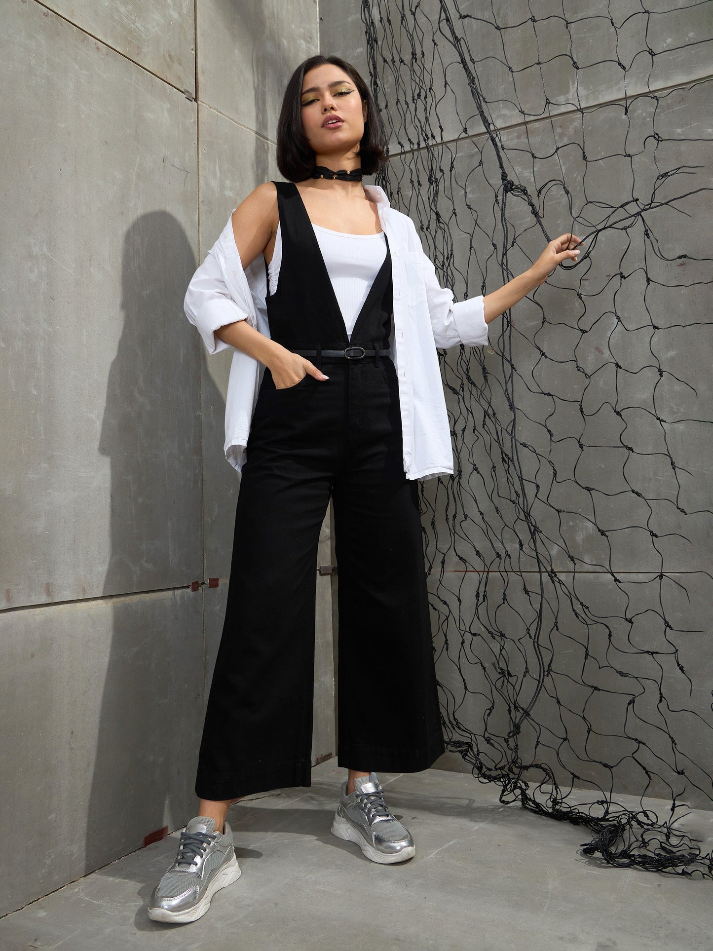 Women's Women Jet Black Deep V-Neck Denim Flared Leg Jumpsuit in Cotton by Sassafras for wholesale, bulk, supplier, manufacturer and wholesaler buyers from Trendphoria