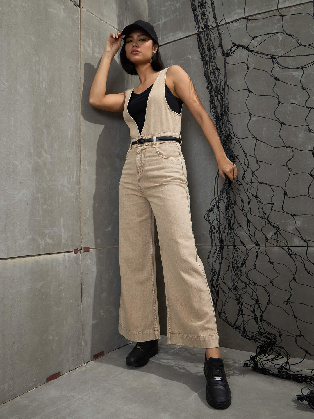 Women's Women Beige Deep V-Neck Denim Flared Leg Jumpsuit in Cotton by Sassafras for wholesale, bulk, supplier, manufacturer and wholesaler buyers from Trendphoria