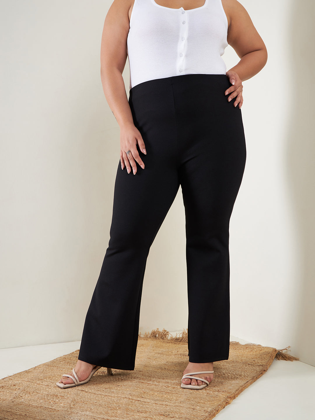 Plus size women's Black Rayon Black Bell Bottom 4-Way Stretch Trousers by Sassafras Curve for wholesale buyers, boutiques, resellers and bulk orders