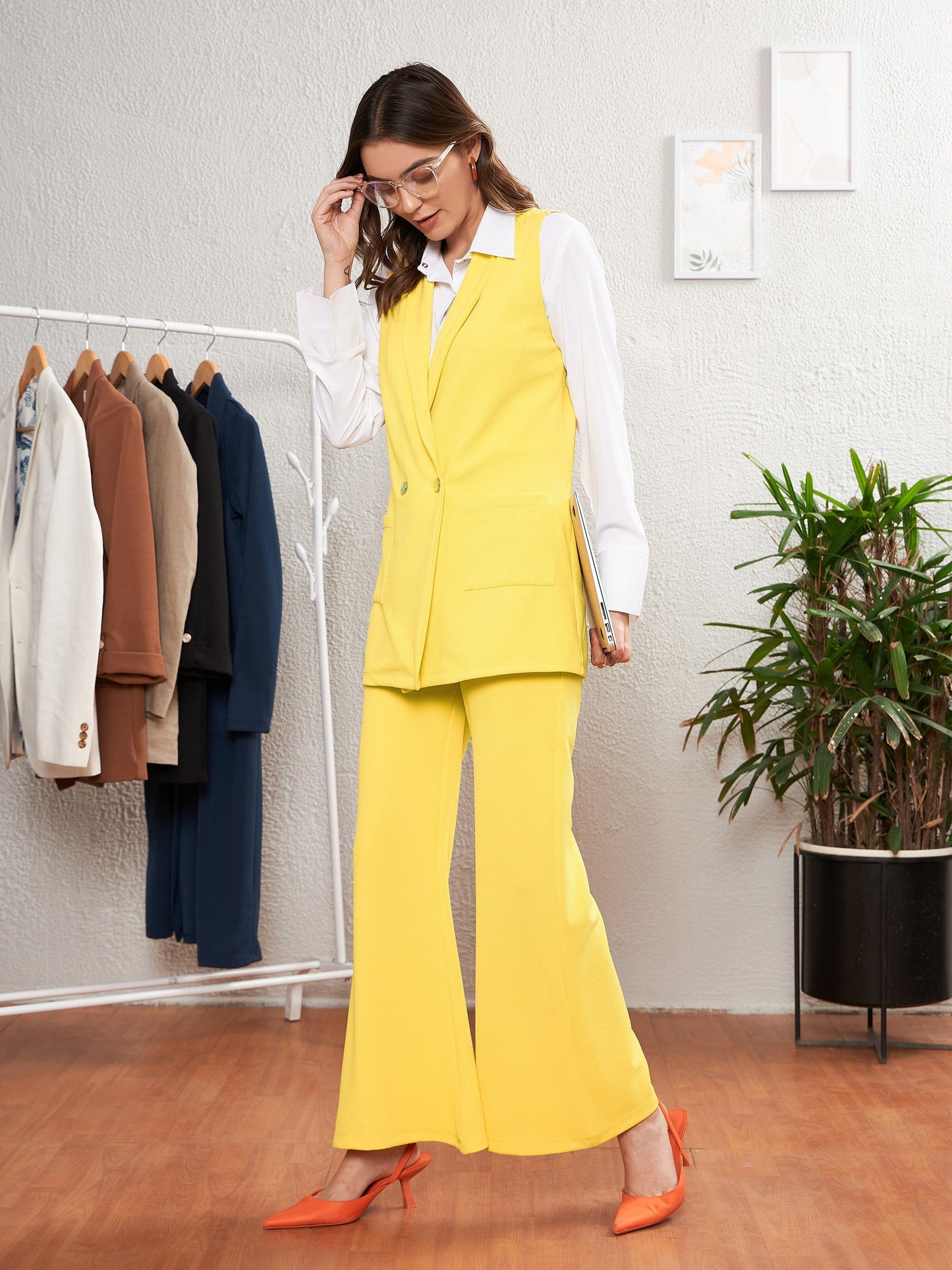 Yellow Sleeveless Blazer With Bell Bottom Pants
