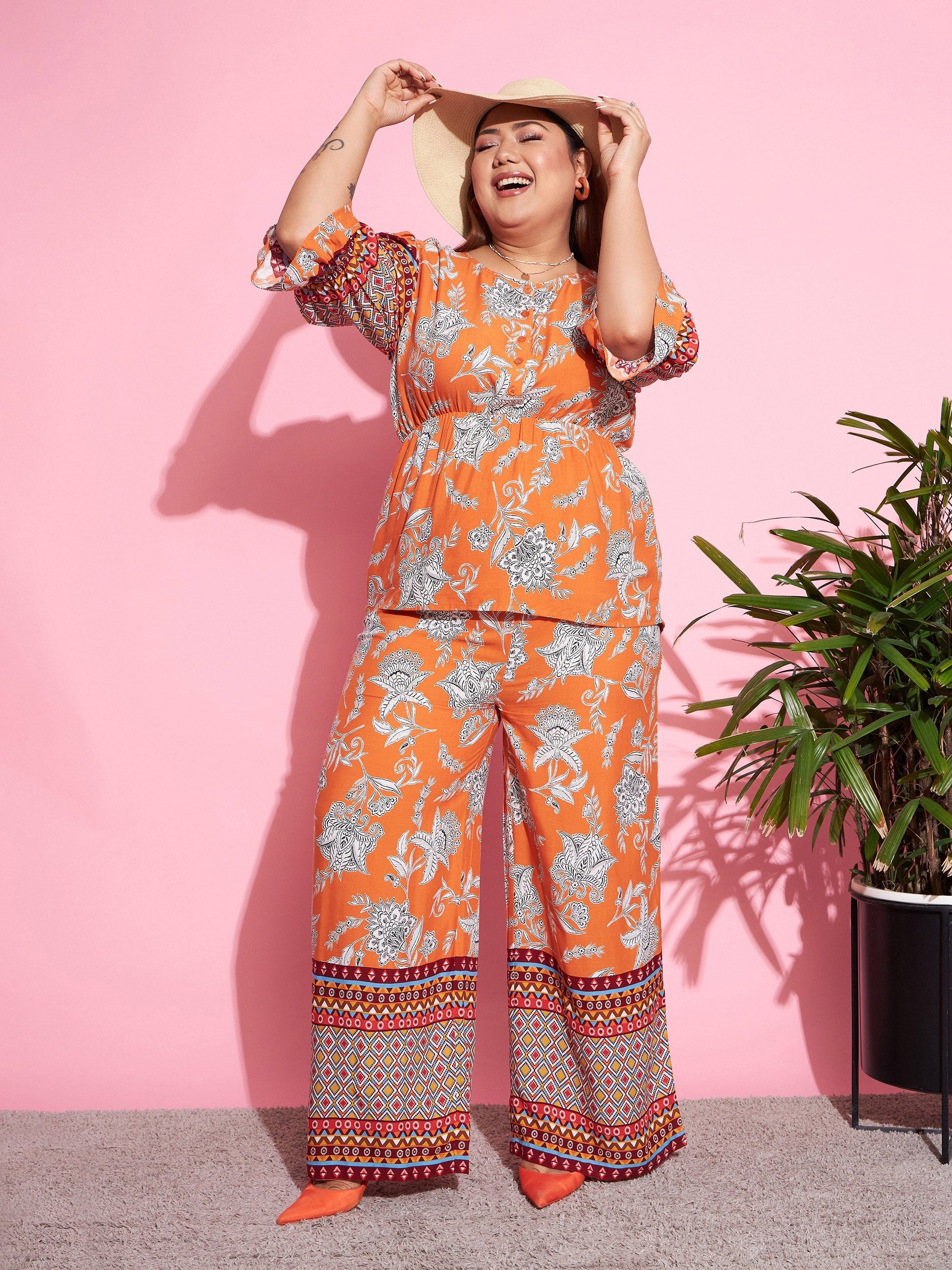 Plus size women's Orange Rayon Orange Floral Peplum Top With Straight Pants by Sassafras Curve for wholesale buyers, boutiques, resellers and bulk
