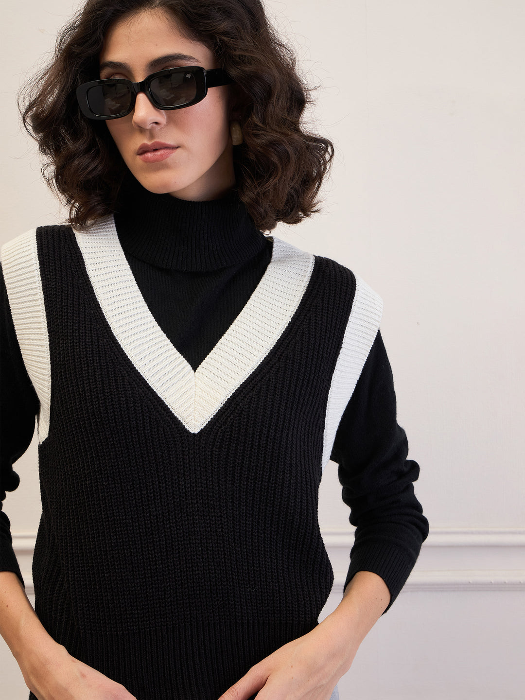 Women's Women Black & White Solid V-Neck Sweater Vest in Acrylic by Sassafras for wholesale, bulk, supplier, manufacturer and wholesaler buyers from Trendphoria