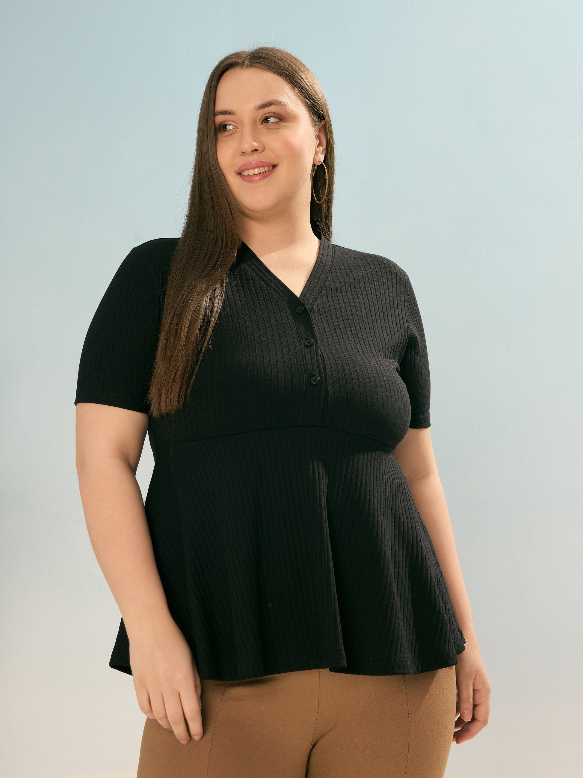 Plus size women's Black Polycotton Black Rib V Neck Peplum Top by Sassafras Curve for wholesale buyers, boutiques, resellers and bulk orders from