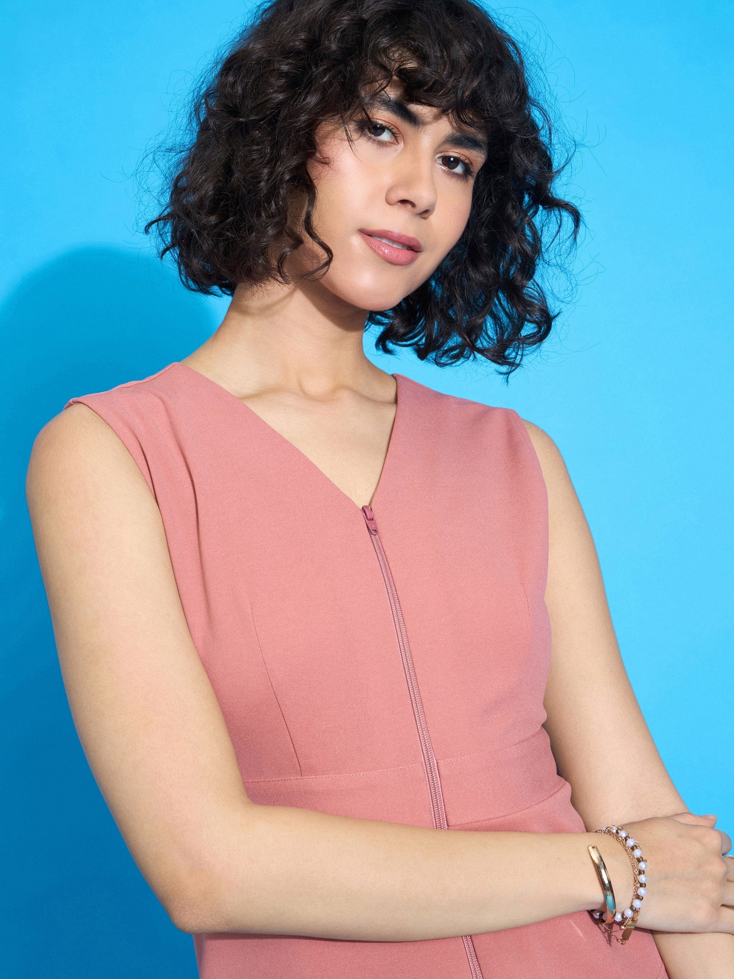 Peach Sleeveless Front Zipper Peplum Top