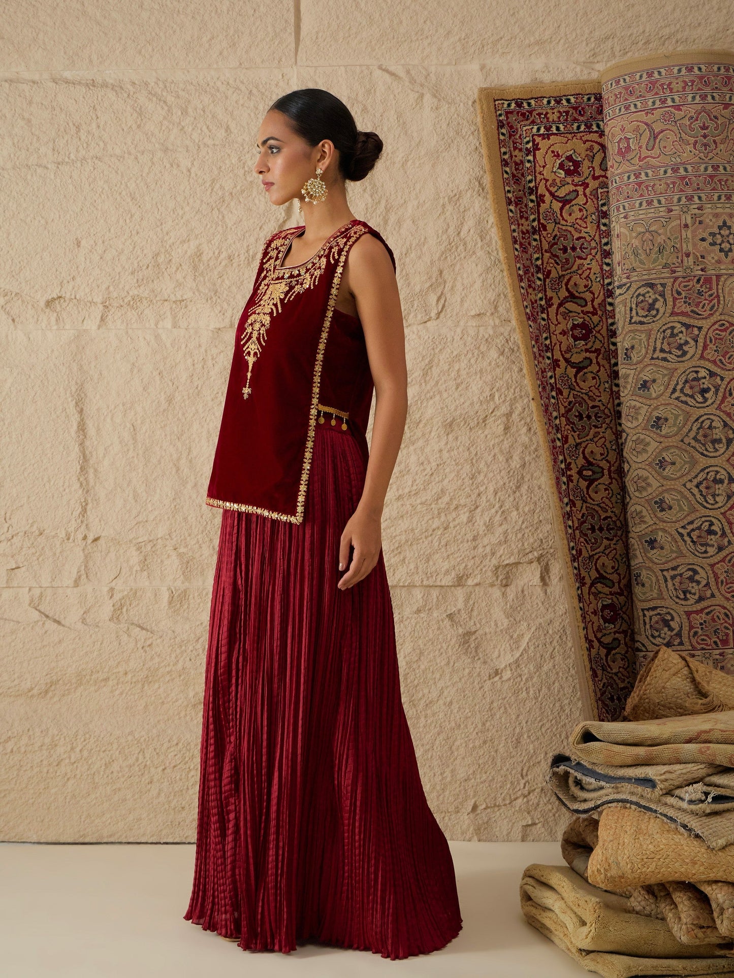 Women Maroon Velvet Sleeveless Top With Pleated Skirt