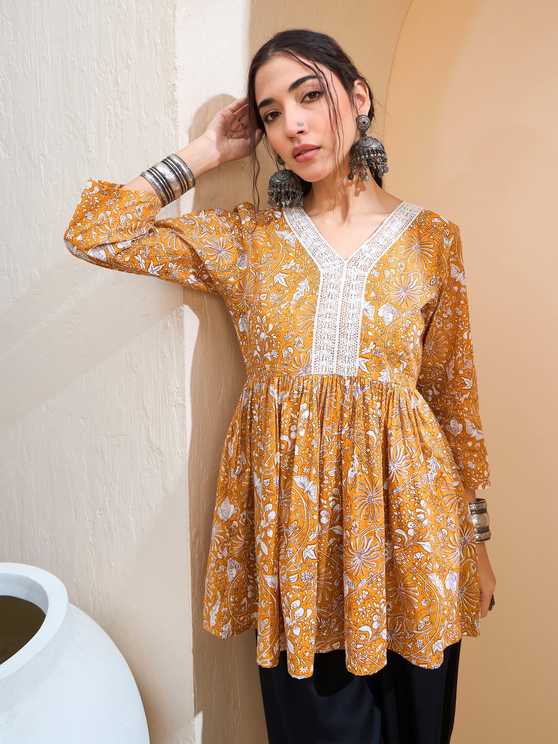 Women's Women Yellow Floral Cambric V Neck Peplum Kurti in Cotton by Shae for wholesale, bulk, supplier, manufacturer and wholesaler buyers from Trendphoria