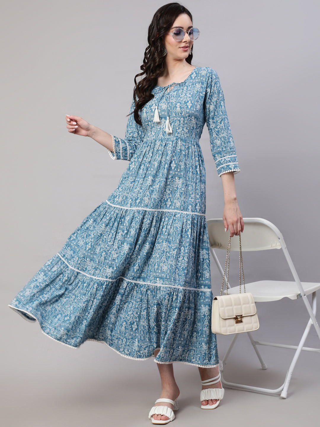 Blue Ethnic Printed Tired Dress With Tie Up Neck