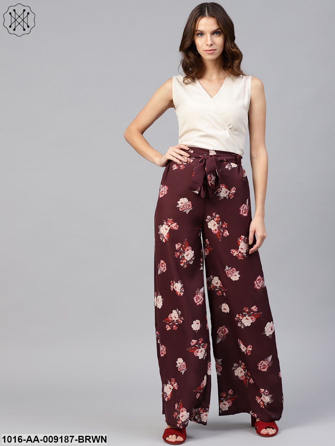 Solid V-Neck Sleevles Top With Floral Printed High -Waisted Ruffled Waistband Attached With A Belt Palazzo Pants