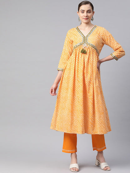Flared Style Cotton Fabric Yellow Color Kurta With Bottom